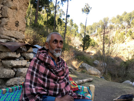 Nooran Shah, 62, talks during an interview with Reuters outside his home which is near to the site where Indian military aircrafts released payload in Jaba village, Balakot, Pakistan February 28, 2019. REUTERS/Asif Shahzad