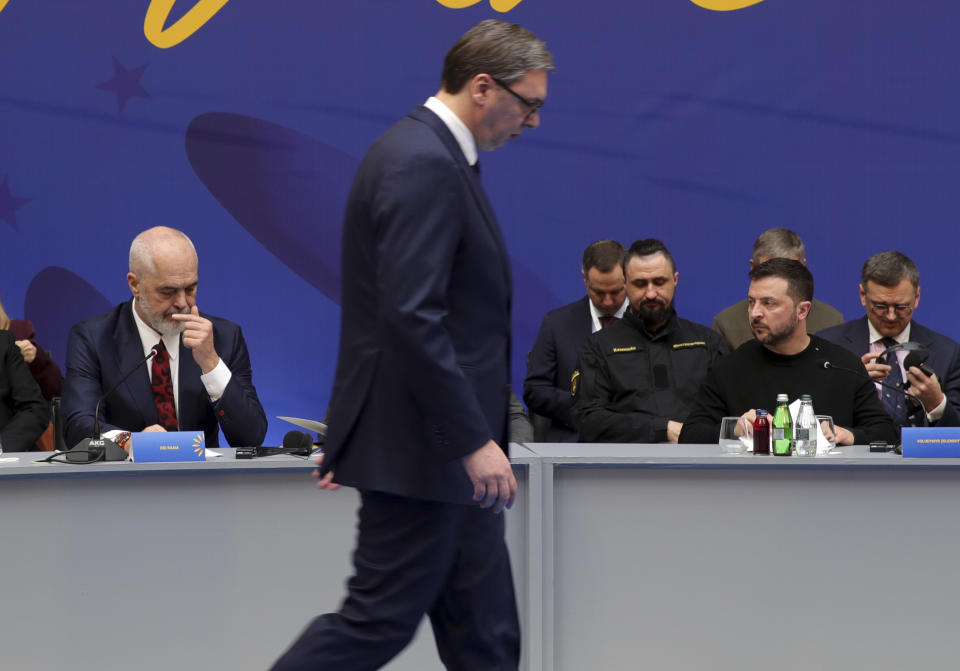 Albanian Prime Minister Edi Rama, left, and Ukrainian President Volodymyr Zelenskyy, right, prepare as Serbian President Aleksandar Vucic walks during the summit of Southeastern European countries on peace in Tirana, Albania, Wednesday, Feb. 28, 2024. Ukraine's president co-hosts a summit with Albania's government on Wednesday that is meant to encourage further support for Kyiv by southeastern European countries, as signs of fatigue grow two years after Russia's full-scale invasion. (AP Photo/Armando Babani, Pool)