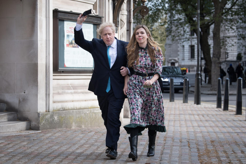 Prime Minister Boris Johnson and his fiancee Carrie Symonds arrive to cast their vote at Methodist Central Hall, central London, in the local and London Mayoral election. Picture date: Thursday May 6, 2021.