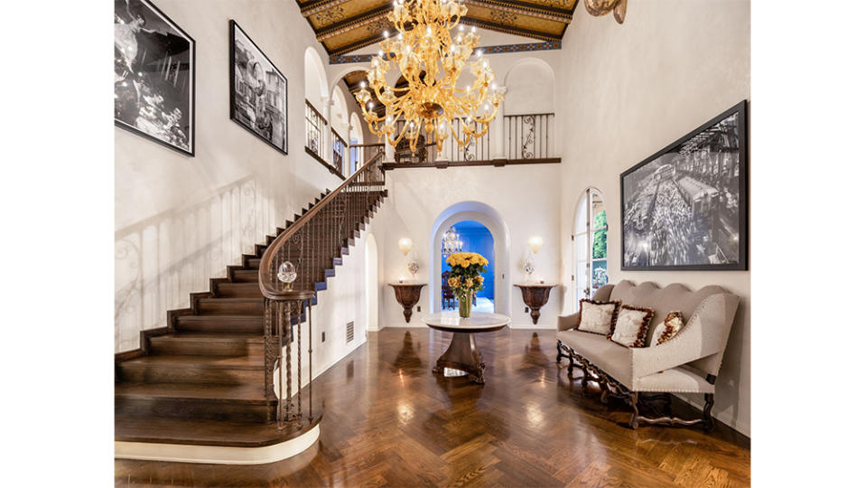 A grand staircase links the first and second floors with show-stopping aplomb.