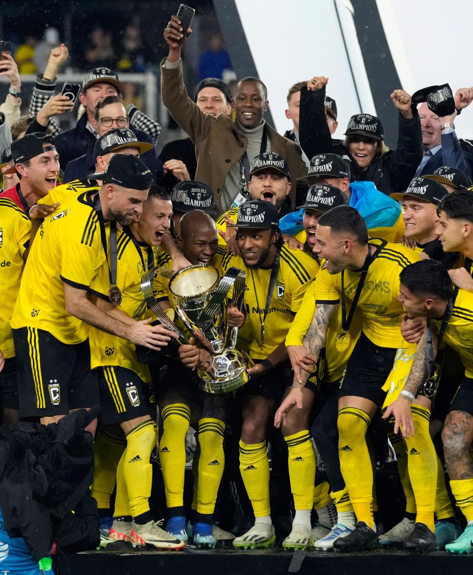 Dec 9, 2023; Columbus, OH, USA; Columbus Crew midfielder Darlington Nagbe (6) and Columbus Crew defender Steven Moreira (31) get ready to hosts up the trophy after a 2-1 win over Los Angeles FC during 2023 MLS CUP at Lower.com Field. Mandatory Credit: Kyle Robertson-USA TODAY Sports