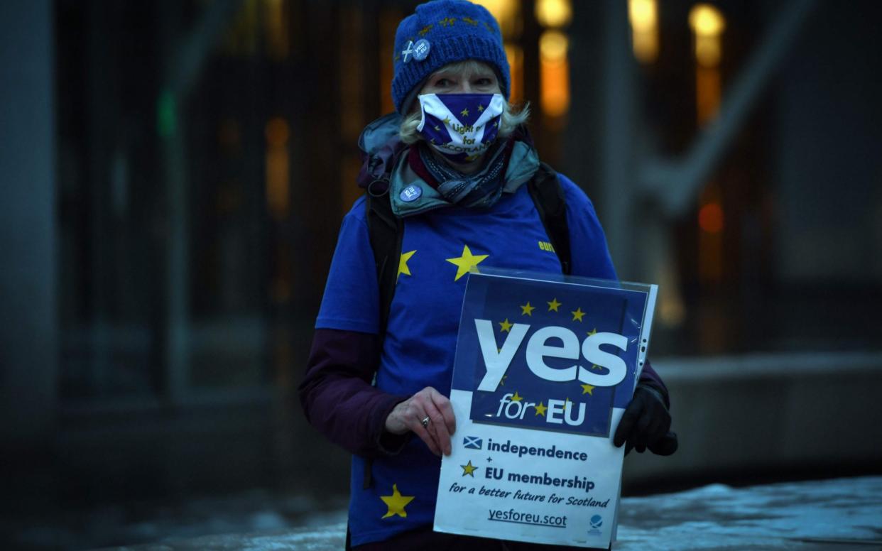 An independence protestor outside the Scottish Parliament last week - AFP