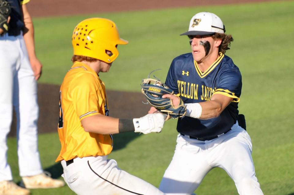 Stephenville's Cade Wright tags out Snyder's Jaden West on Thursday, May 26, 2022 at ACU's Crutcher Scott Field.