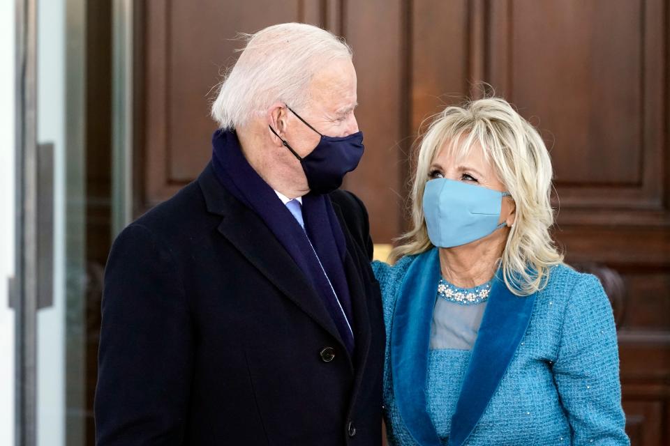 President Joe Biden and first lady Jill Biden hug as they arrive at the North Portico of the White House, Wednesday, Jan. 20, 2021, in Washington.