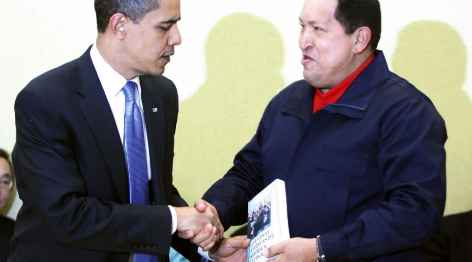 Venezuelan President Hugo Chavez gives US President Barack Obama a copy of Las Venas Abiertas de America Latina. Photo: REUTERS/Kevin Lamarque