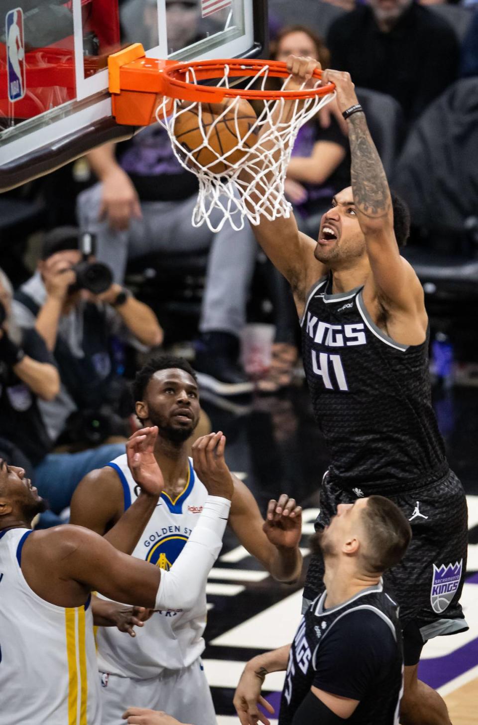 Sacramento Kings forward Trey Lyles (41) dunks the ball against the Golden State Warriors during the second half of Game 1 of the first-round NBA basketball playoff series at Golden 1 Center on Saturday, April 15, 2023.