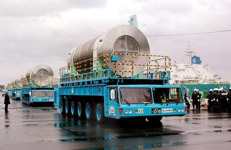 Canisters containing spent nuclear fuel are carried on trailers to the nuclear reprocessing plant at Rokkasho village in Aomori prefecture, 600km north of Tokyo, on December 19, 2000. Japan's only reprocessing plant for spent nuclear fuel could sit on an active seismic fault vulnerable to a massive earthquake, experts warned Wednesday