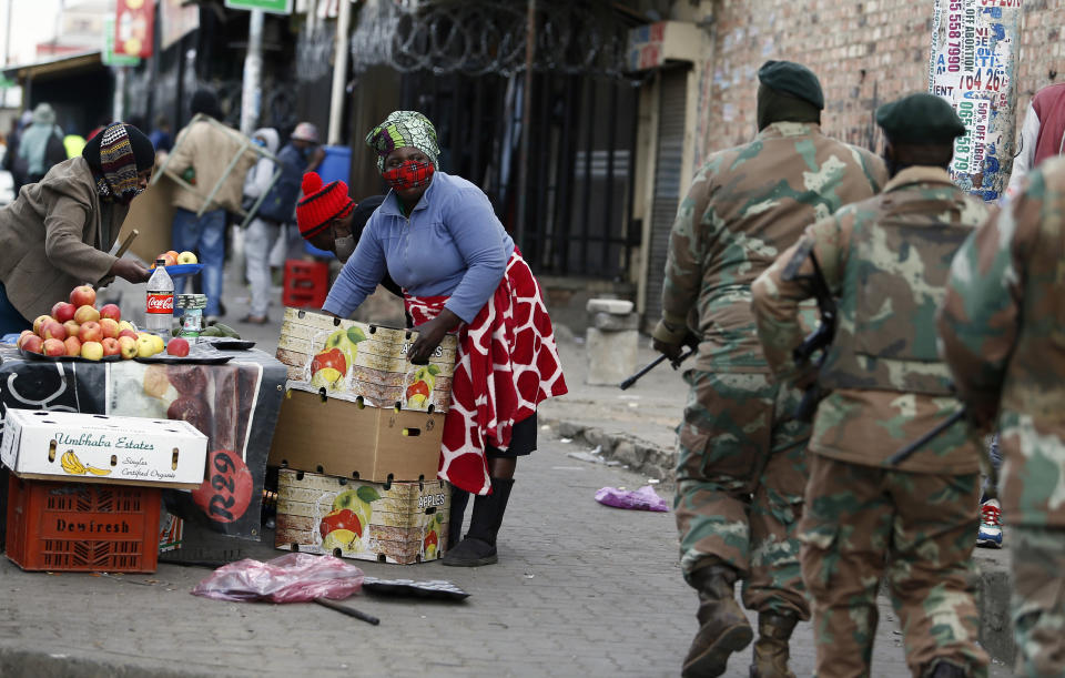 South African Defence Force soldiers on patrol in Alexandra Township, north of Johannesburg, Thursday, July 15 2021. The arm has begun deploying 25,000 troops to assist police in quelling the weeklong riots and violence sparked by the imprisonment of former President Jacob Zuma. (AP Photo)