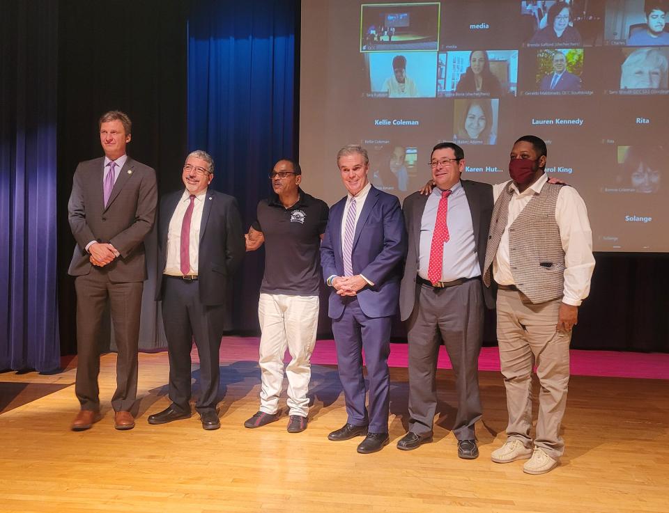 From left, Sheriff Lewis G. Evangelidis, QCC President Luis Pedraja, Derrick Kiser, District Attorney Joseph D. Early Jr., District Court Judge Timothy M. Bibaud and Sean Harris, corporate development specialist in academic affairs at QCC.