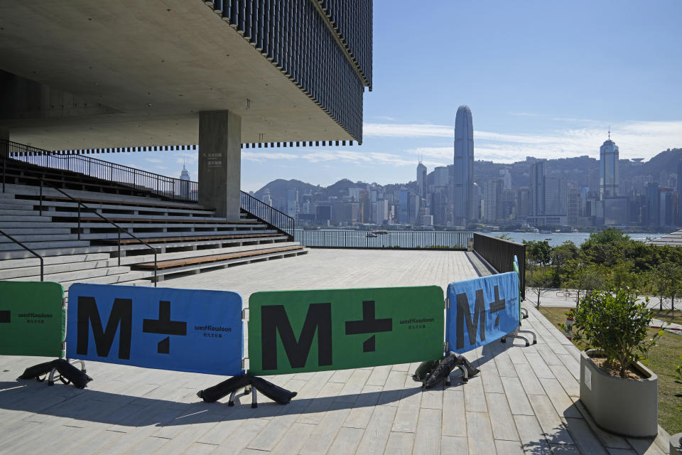 Barriers are set outside the M+ visual culture museum in the West Kowloon Cultural District of Hong Kong, Thursday, Nov. 11, 2021. Hong Kong's swanky new M+ museum _ Asia's largest gallery with a billion-dollar collection _ is set to open on Friday amid controversy over politics and censorship. (AP Photo/Kin Cheung)