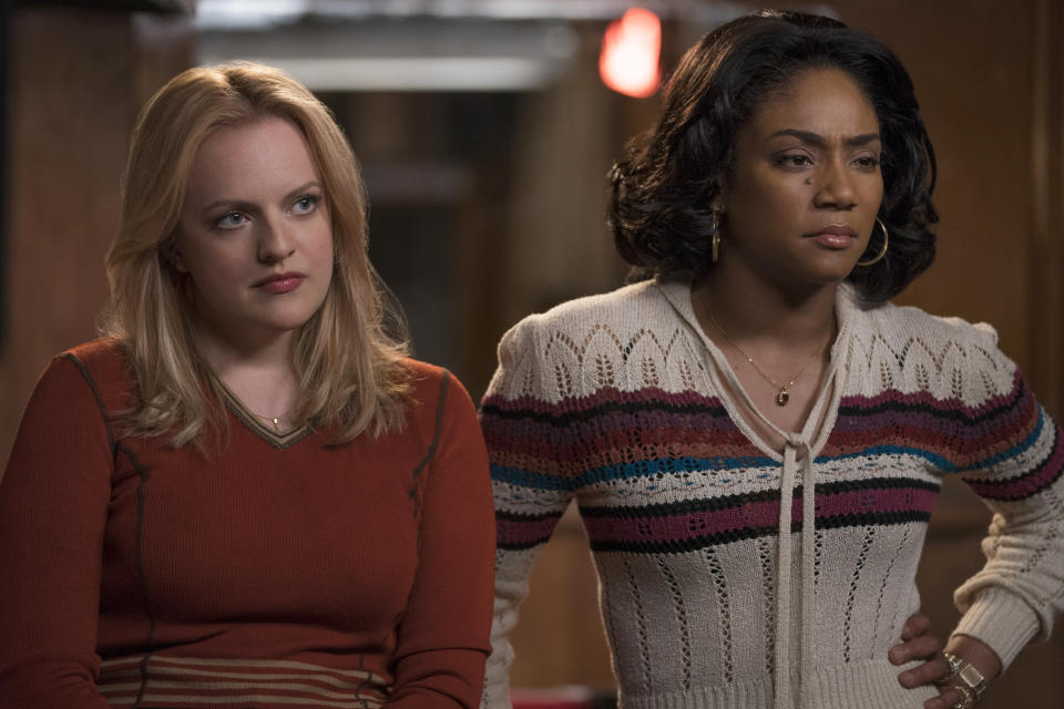 This image released by Warner Bros. Pictures shows, from left, Elisabeth Moss and Tiffany Haddish in a scene from "The Kitchen." (Alison Cohen Rosa/Warner Bros. Pictures via AP)