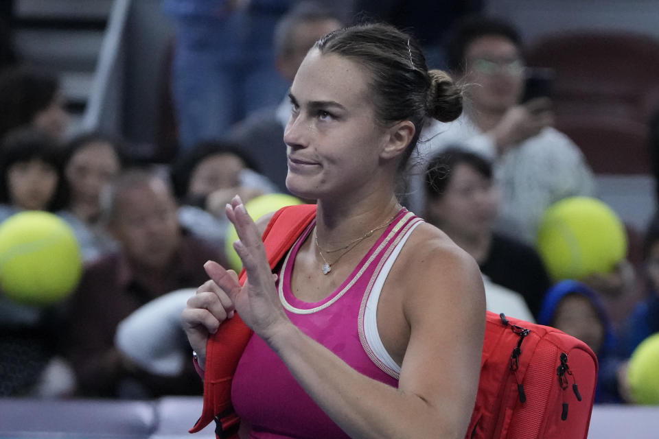 Aryna Sabalenka of Belarus leaves the court after defeated by Elena Rybakina of Kazakhstan in the women's singles quarterfinal match of the China Open tennis tournament at the Diamond Court in Beijing, Friday, Oct. 6, 2023. (AP Photo/Andy Wong)