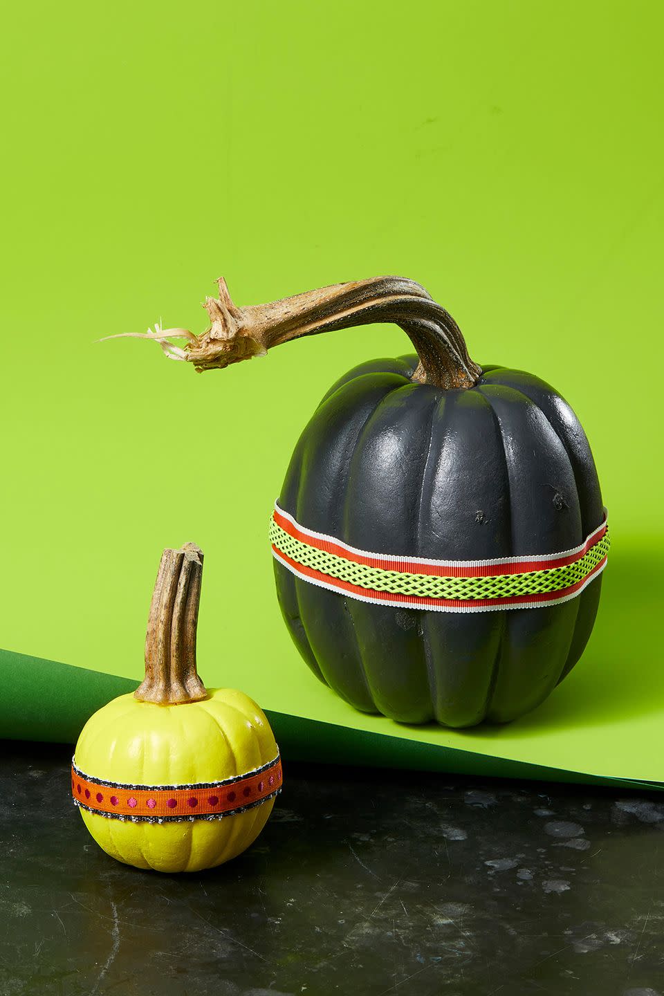 <p>Adding personality to your pumpkins can be as simple as cutting some ribbon. Start by painting your pumpkin (or leave it natural for a more rustic look). Then, cut a length of ribbon or trim to fit the width of a pumpkin. To finish, just attach it with a few drops of hot glue. If you're feeling creative, layer ribbons and trim for an even more custom look.</p><p><a class="link " href="https://www.amazon.com/Ribbon%EF%BC%8CThanksgiving-Halloween-Christmas-Wrapping-Decoration/dp/B094VMSTLC/?tag=syn-yahoo-20&ascsubtag=%5Bartid%7C10055.g.1714%5Bsrc%7Cyahoo-us" rel="nofollow noopener" target="_blank" data-ylk="slk:SHOP RIBBON;elm:context_link;itc:0;sec:content-canvas">SHOP RIBBON </a></p>