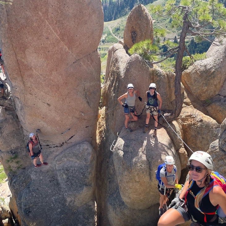 Climbers on the via ferrata at the Palisades resort in California's Olympic Valley