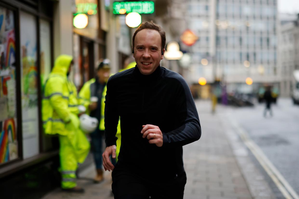 Britain's Health Secretary Matt Hancock poses running past photographers whilst out for a morning jog in Westminster central London on December 4, 2020. (Photo by Tolga Akmen / AFP) (Photo by TOLGA AKMEN/AFP via Getty Images)