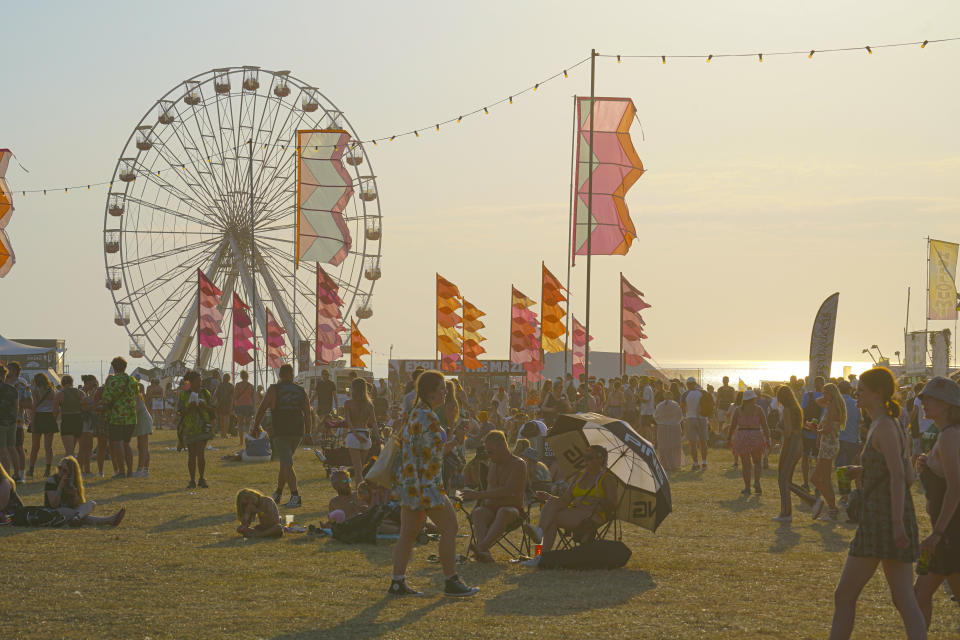 NEWQUAY, ENGLAND - AUGUST 12: Young people enjoy the sunshine on the first day of the Boardmasters Music Festival at Watergate Bay on August 12, 2022 in Newquay, England. Over 50,000 young festival-goers are expected to attend the three-day music event which runs alongside the Boardmasters surf event in Newquay. (Photo by Hugh R Hastings/Getty Images)