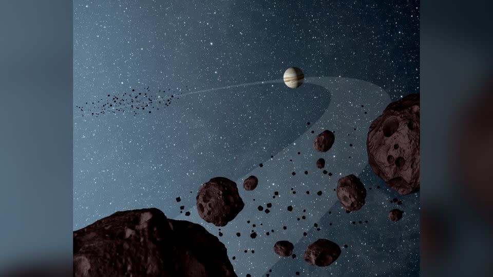Cette illustration représente les essaims d’astéroïdes troyens qui existent sur la même orbite que Jupiter.  -JPL-Caltech/NASA