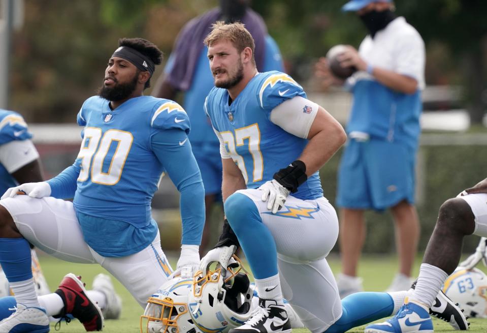 Jessie Lemonier, left, shown at the Los Angeles Chargers' training camp in 2020.