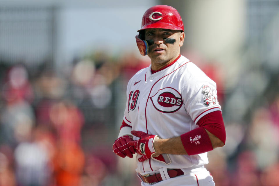 FILE - Cincinnati Reds' Joey Votto stands at first base after hitting a single during a baseball game against the Pittsburgh Pirates in Cincinnati, Sunday, Sept. 24, 2023. The former NL MVP says he has agreed to a minor league contract with his hometown Toronto Blue Jays. Votto, 40, became a free agent last fall after the end of a $251.5 million, 12-year contract with the Cincinnati Reds, his only team over 17 major league season. (AP Photo/Aaron Doster, File)