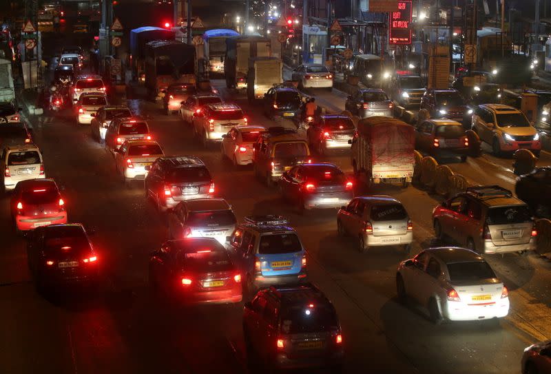 FILE PHOTO: Vehicles are pictured at a toll post in Mumbai