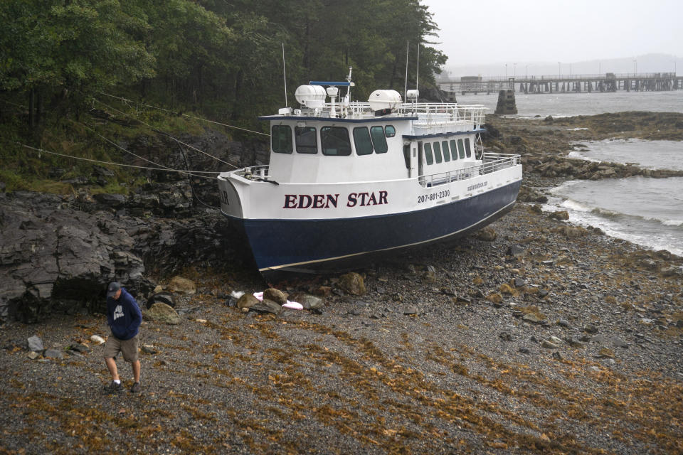 The Eden Star, a 70-foot tour boat, is secured to the shore after breaking free of its mooring during storm Lee, Saturday, Sept. 16, 2023, in Bar Harbor, Maine, (AP Photo/Robert F. Bukaty)