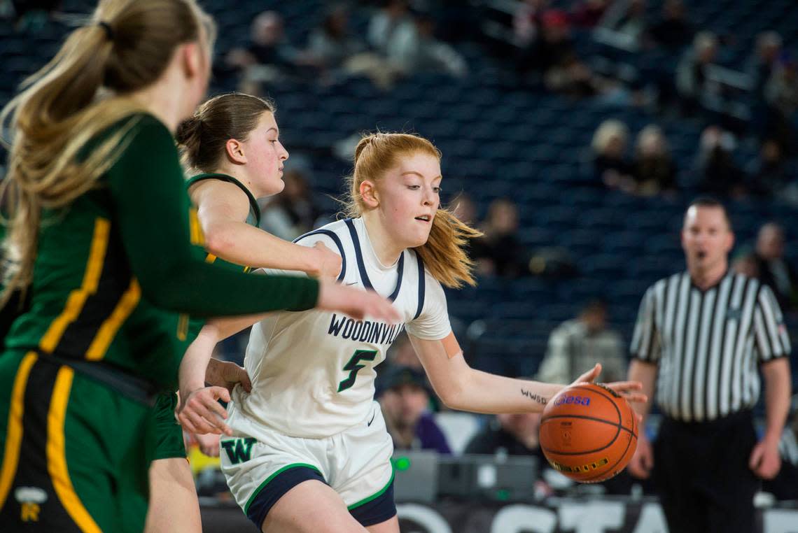 Woodinville forward Jaecy Eggers (5) drives to the basket in the second quarter against Richland in the opening round of the Class 4A girls state basketball tournament on Wednesday, March 1, 2023 at the Tacoma Dome in Tacoma, Wash.