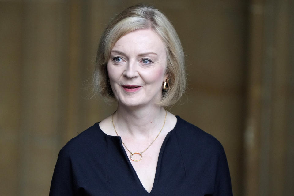 FILE - Britain's Prime Minister Liz Truss leaves Westminster Hall, in the Palace of Westminster, where the House of Commons and the House of Lords met to express their condolences in London, Monday, Sept. 12, 2022. British Prime Minister Liz Truss took office less than two weeks ago, impatient to set her stamp on government. The death of Queen Elizabeth II ripped up Truss’s carefully laid plans for the first weeks of her term, putting everyday politics in the U.K. on hold as the country was plunged into official and emotional mourning. (AP Photo/Markus Schreiber, Pool, File)