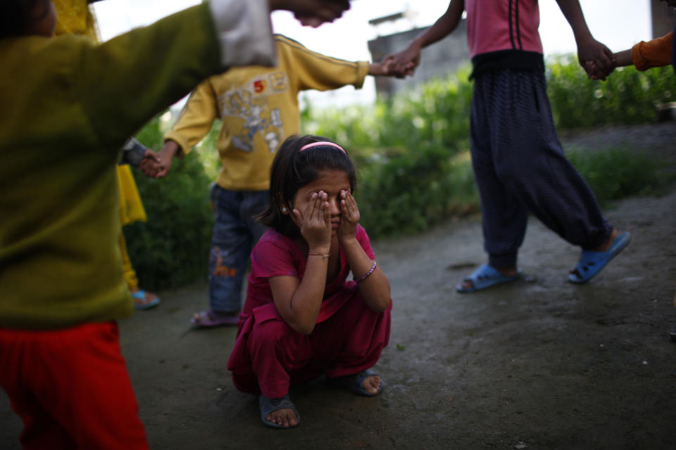 In this Tuesday, Aug. 21, 2012 photo, Pushpa Bhandari, an 8-year-old HIV patient, plays with her friends at the Saphalta HIV Shiksya Sadan School, in Kirtipur, near Katmandu. Over the past three years, ten orphan children with HIV have come to the two-story house converted into a school by a high-school teacher named Raj Kumar Pun and a friend just outside the capital of this Himalayan nation. Soon, though, the makeshift home and school will close, since Pun, who has become weighed down by the relentless bills of keeping everything running was forced to sell the house. (AP Photo/Niranjan Shrestha)