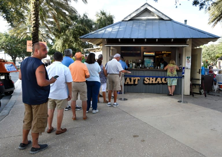 Residents line up for happy hour at the Bait Shack Bar in The Villages retirement community, an important Republican stronghold for Donald Trump in Florida