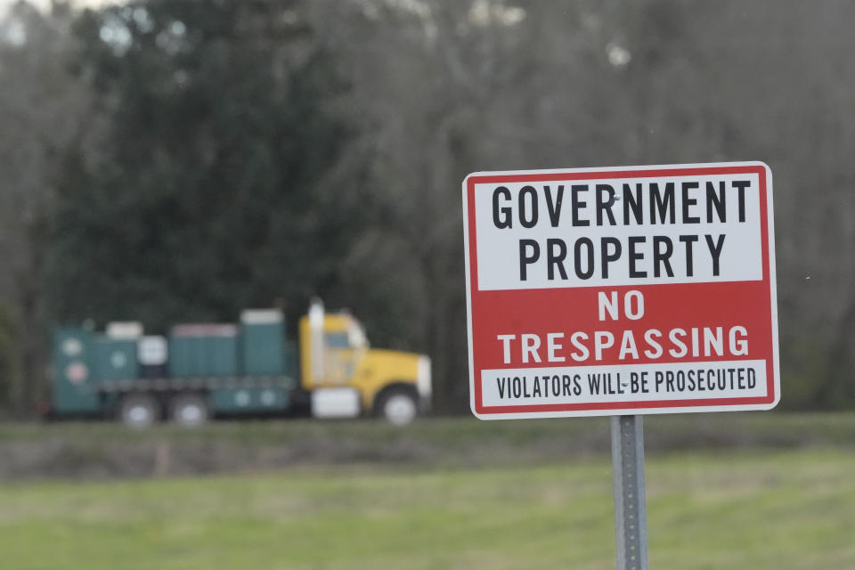 A truck leaves the site of a planned Rivian electric truck plant Thursday, March 7, 2024, in Rutledge,Ga. Rivian says it's pausing construction of the $5 billion manufacturing plant in Georgia. (AP Photo/John Bazemore)