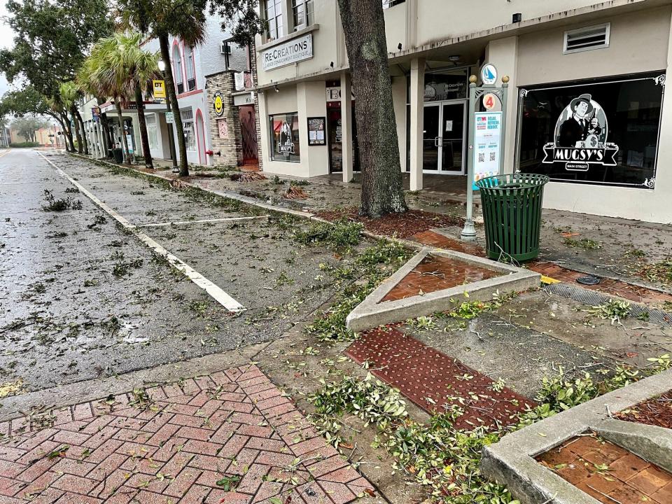 By 7:30 a.m. Thursday, tree branch debris from Ian's winds littered New Haven Avenue in downtown Melbourne -- but no obvious structural damages were apparent.