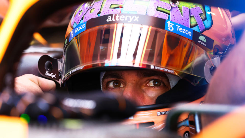 Daniel Ricciardo is pictured in the cockpit of his F1 car.