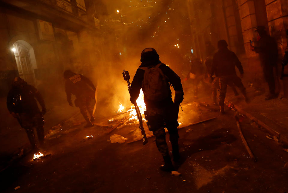 Law enforcement personnel are seen during clashes between protesters against Bolivia's President Evo Morales and government supporters, in La Paz, Bolivia Nov. 7, 2019. (Photo: Kai Pfaffenbach/Reuters)