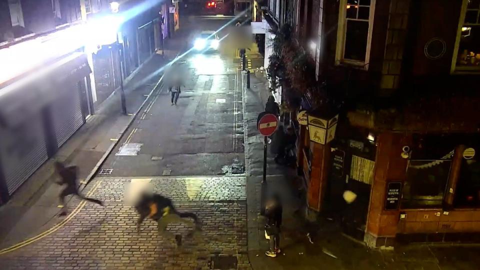 A still from the footage shows robbers fleeing (Met Police)