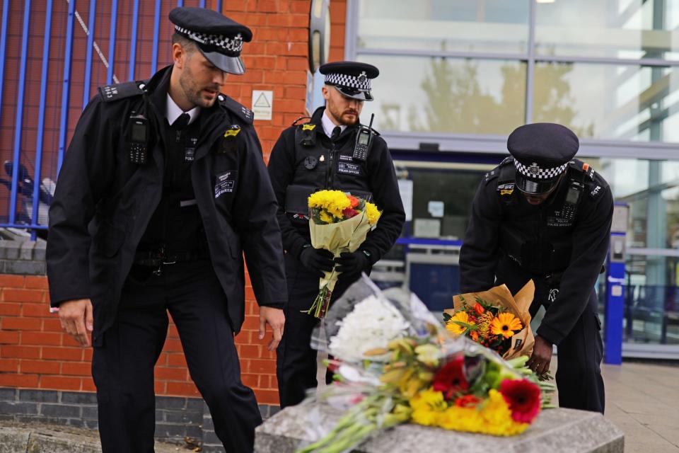 Officers paying tribute (PA)