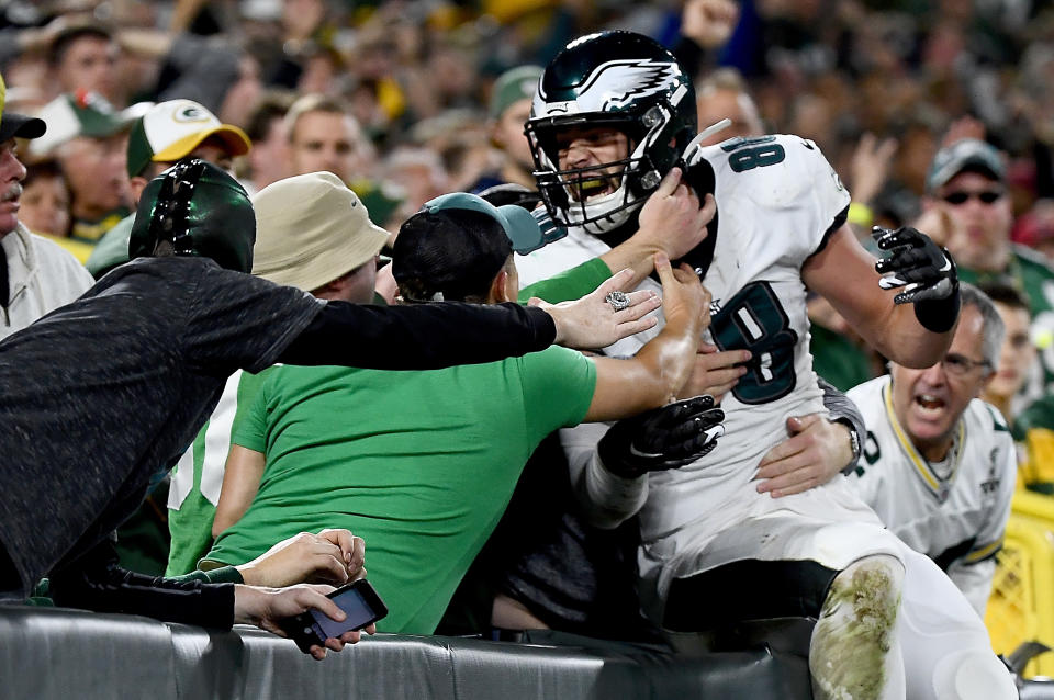 Dallas Goedert jumps into the stands after a touchdown against the Packers. (Getty Images)