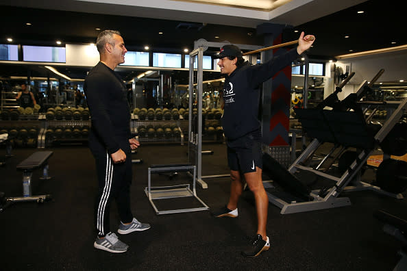 A personal trainer and his client are seen working out in City Gym in Sydney, Australia. 