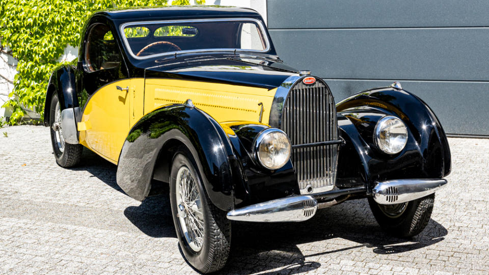 Bugatti’s Type 57C Atalante was often presented with oversized headlights and a two-tone color combination reflecting Art Deco style. - Credit: Bonhams