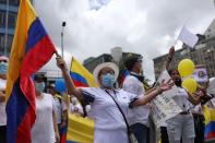 People march against road blockades in Bogota