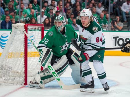 Apr 14, 2016; Dallas, TX, USA; Minnesota Wild center Mikael Granlund (64) looks for the puck in front of Dallas Stars goalie Kari Lehtonen (32) during the first period in game one of the first round of the 2016 Stanley Cup Playoffs at American Airlines Center. Jerome Miron-USA TODAY Sports