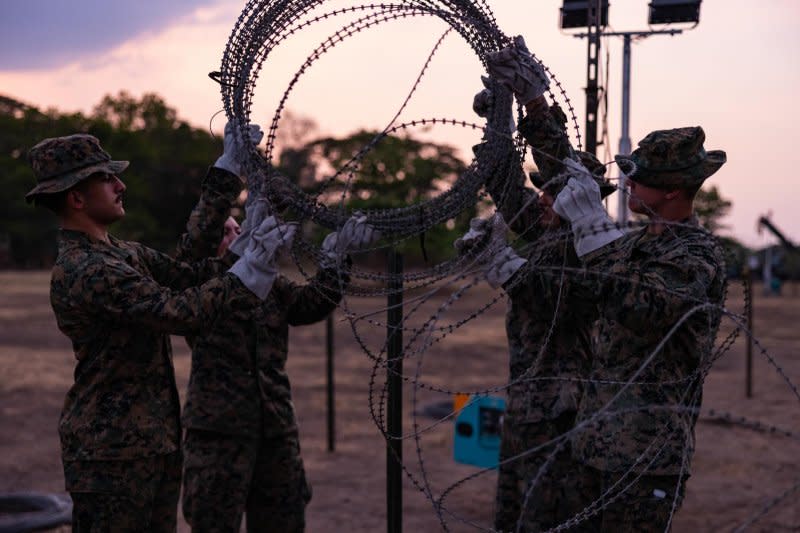 U.S. Marines set up concertina wire before the Balikatan exercise at Camp Aquino, Philippines, on Wednesday. Photo by Lance Cpl. Evelyn Doherty/U.S. Marine Corps