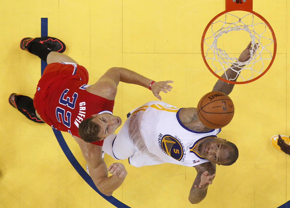 Los Angeles Clippers forward Blake Griffin (32) shoots against Golden State Warriors power forward Marreese Speights (5) during the first half of Game 6 of an opening-round NBA basketball playoff series in Oakland, Calif., Thursday, May 1, 2014. (AP Photo/Marcio Jose Sanchez)