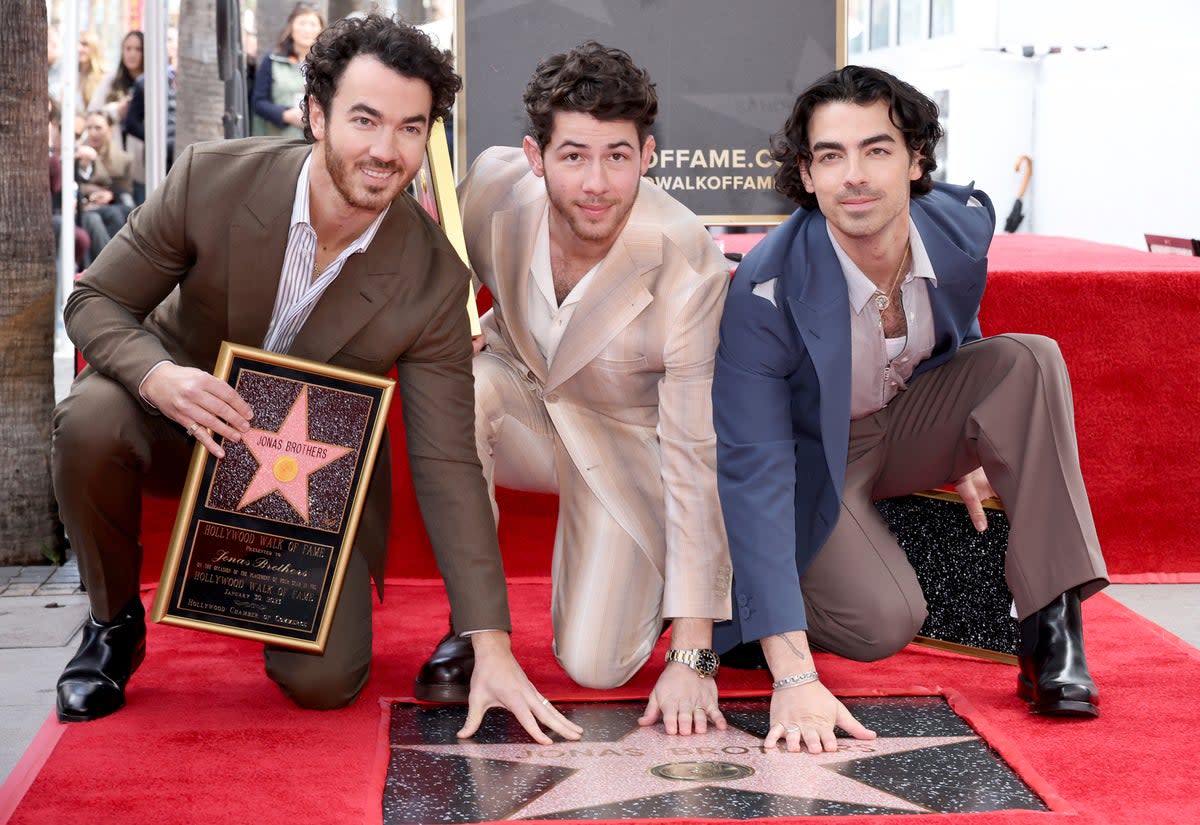 Kevin Jonas, Nick Jonas, and Joe Jonas of The Jonas Brothers attend The Hollywood Walk of Fame star ceremony honoring The Jonas Brothers on January 30, 2023 (Getty Images)