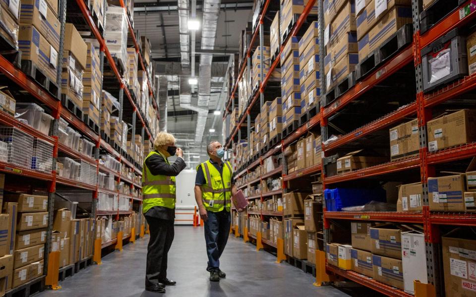 Boris Johnson with Laurence Wilkinson, warehouse supervisor at Oxford Biomedica - Heathcliff O'Malley