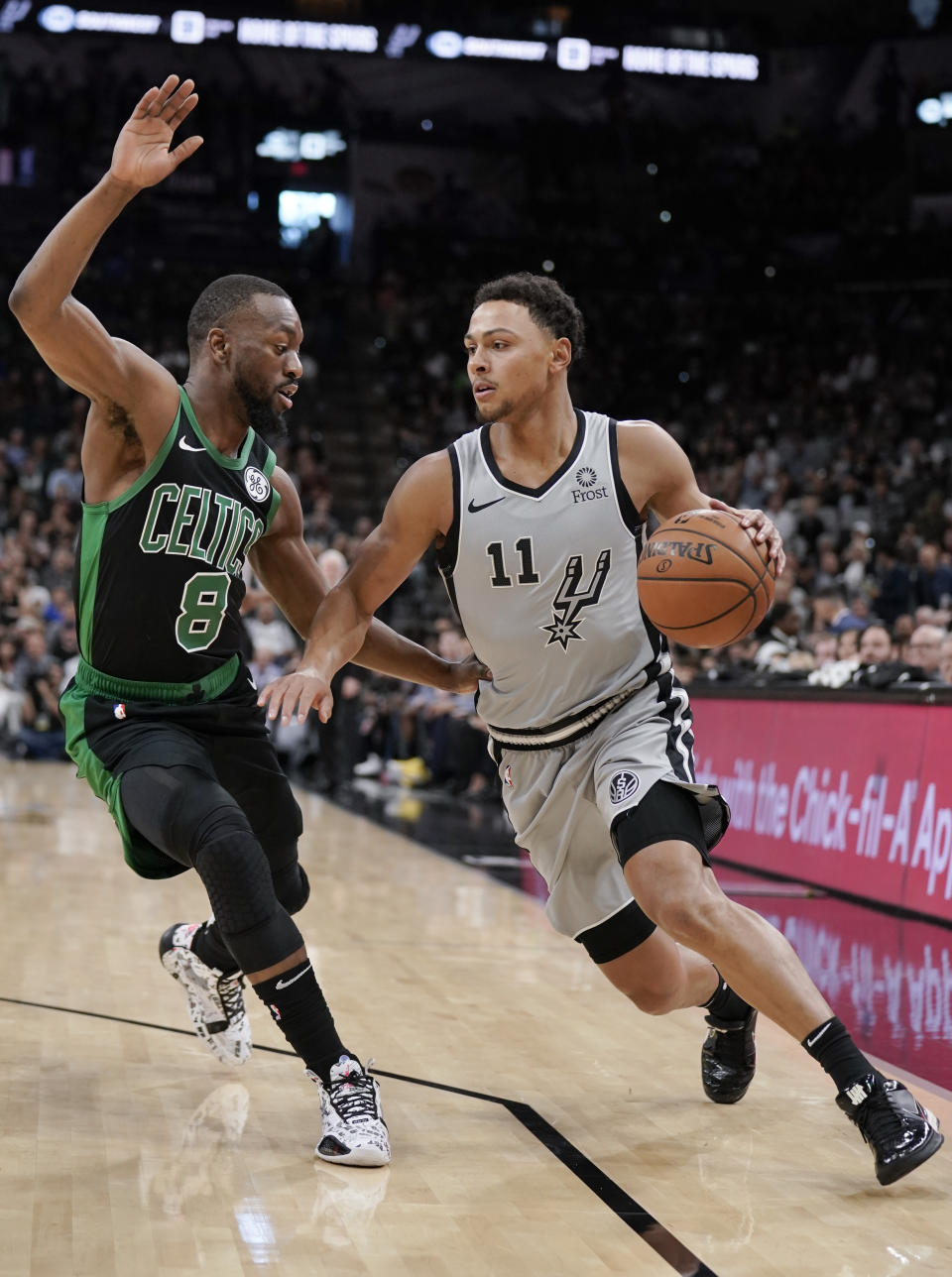 San Antonio Spurs' Bryn Forbes (11) drives against Boston Celtics' Kemba Walker during the first half of an NBA basketball game, Saturday, Nov. 9, 2019, in San Antonio. (AP Photo/Darren Abate)