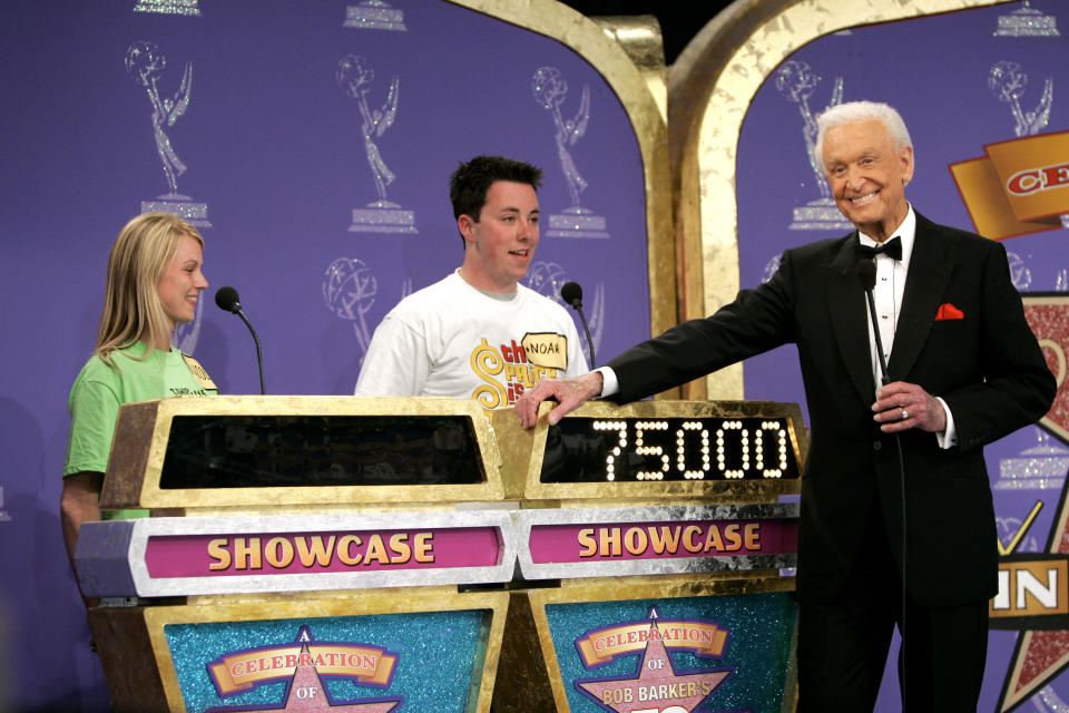 Bob Barker appears with two contestants on The Price Is Right
