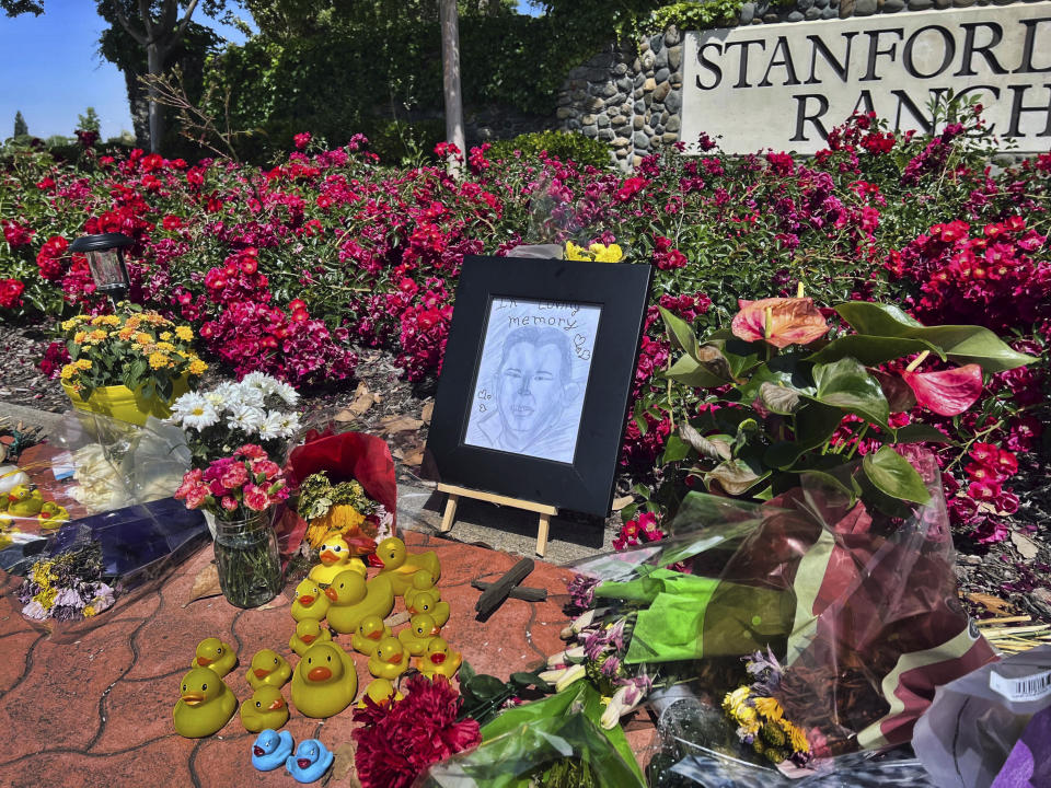A memorial near the Stanford Ranch Plaza in Rocklin, Calif., on Tuesday, May 23, 2023, that honors Casey Rivara, a man who died after being struck by a car last Thursday while helping a mama duck and her ducklings cross the street. (AP Photo/Sophie Austin)