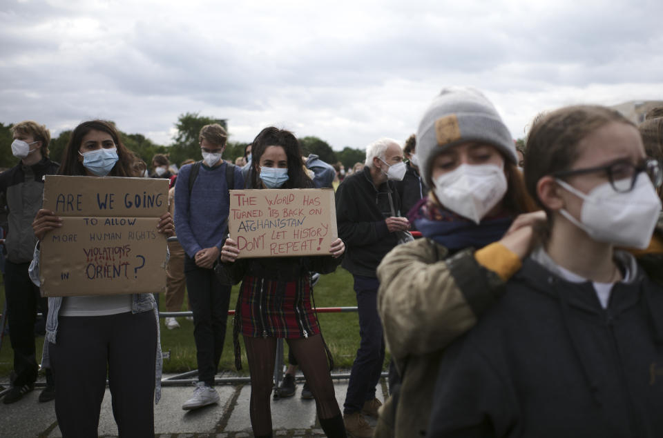 People hold a posters during a demonstration in Berlin, Germany, Tuesday, Aug. 17, 2021. Several hundreds of people attend a demonstration to support an air bridge to bring people out of the Taliban controlled country. (Photo/Markus Schreiber)