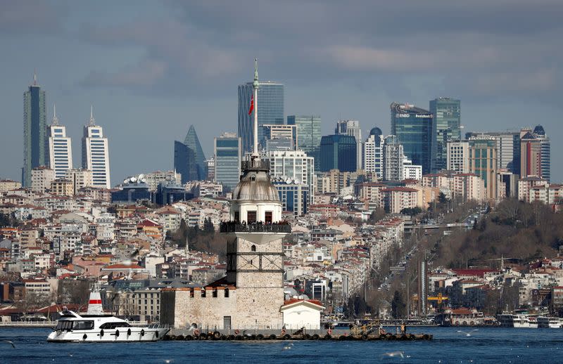 FILE PHOTO: Maiden's Tower, an islet on the Bosphorus, is pictured with the city's skyscrapers in the background in Istanbul