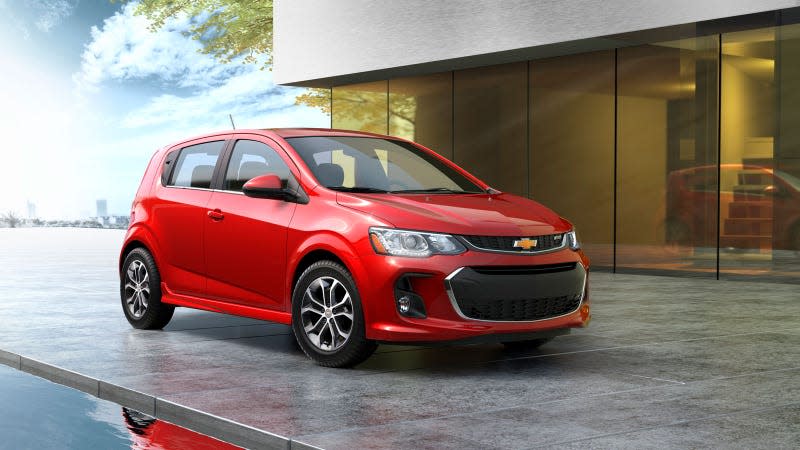 A photo of a red Chevrolet Sonic hatchback. 
